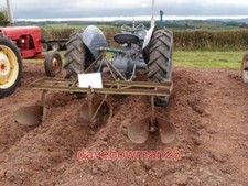 PHOTO  THREE ROW POTATO RIDGER