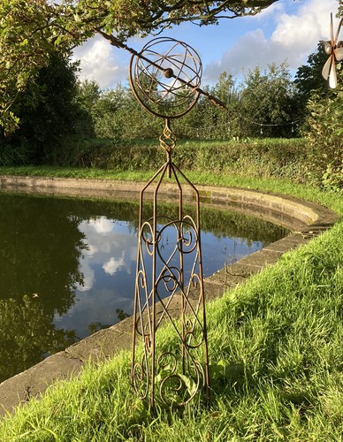 Rusty metal garden armillary - metal,