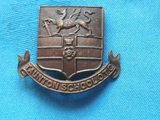 The Taunton School Officer Training Corp cap badge.