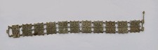 Intricate vintage/antique panel bracelet, low grade silver, screw in closure.