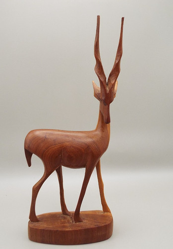 Carved wooden figure an - of,