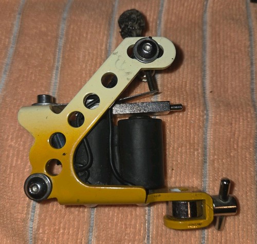 Yellow coil tattoo machine