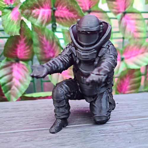 Spaceman figure pen holder
