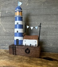 Shoeless Joe Lighthouse Cottage Bunting And Ladder Off The Pier. Wooden Nautical