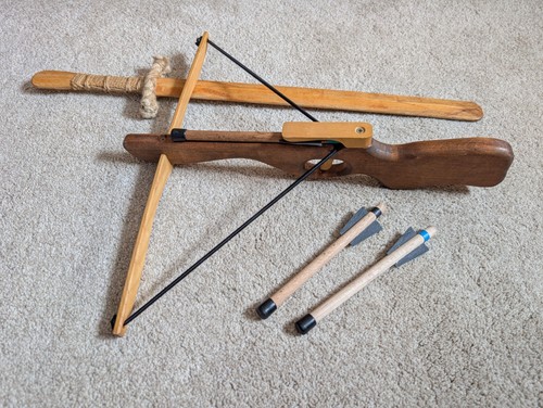 Toy wooden sword and crossbow