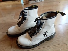white leather Dr. Martens