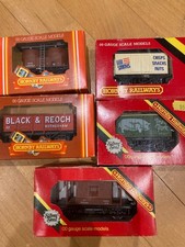 Five Hornby 00 gauge wagons including prime pork and twin silo wagon