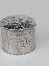 silver pill box with cherub