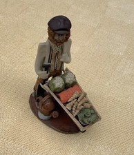 LAURA DUNN STUDIO POTTERY FIGURE - MAN WITH WHEELBARROW FULL OF VEGETABLES