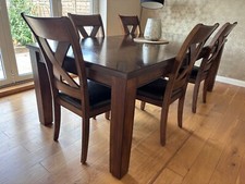 Extendable solid wood dining table - Costco