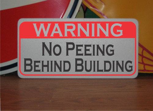 Peeing behind building - no,