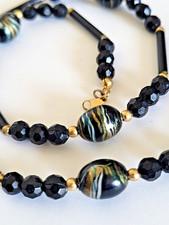 Vintage 1950's Retro black Lucite necklace with gold & blue swirls & tube beads
