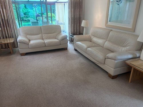 Pair cream leather sofas - pair,
