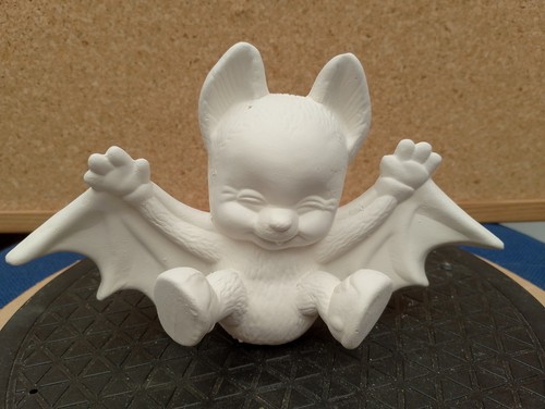 Unpainted ceramic bisque bat - -,