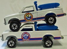 Hotwheels Two Beach patrol Chevy Trucks French and hong kong