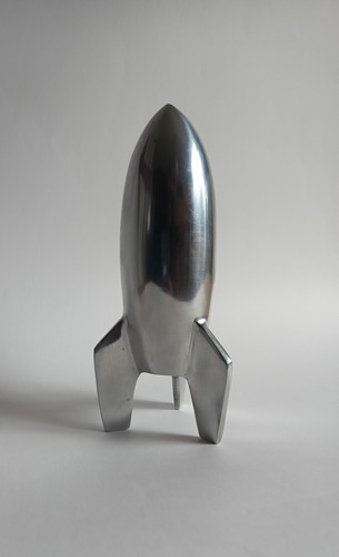 Shiny metallic rocket ship for - metallic,