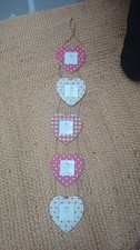 White wooden Heart Photo FRAMES hanging On Rope 3 Square Photos