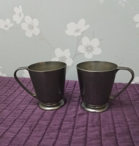 Two identical pewter - identical,