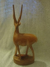A wooden hand carved Deer impala. 205mm tall. Tail has a chip. Good cond. 1970's