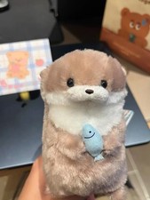 Cute Little Otter Hug Fish