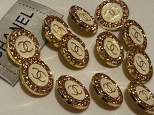12 CHANEL BUTTONS TAKEN FROM