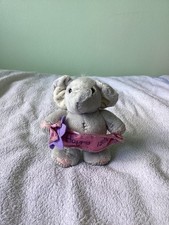 Elliot buttons elephant with - &,