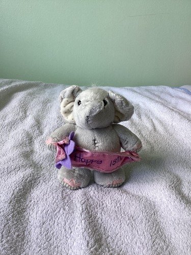 Elliot buttons elephant with - &,