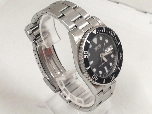 Self winding analog wristwatch - self,