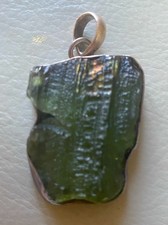 Raw Moldavite pendant with a