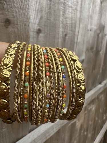 Gold bangles set with 3 - of,