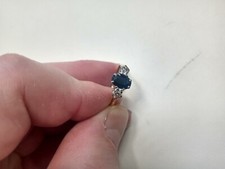 Tested as 18 carat gold and 18ct stamped Sapphire and Diamond 3 stone ring.