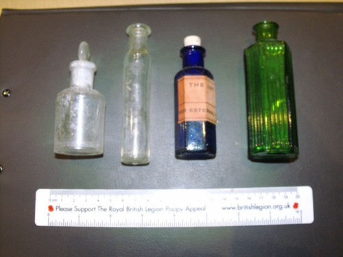 Four small old bottles - old,