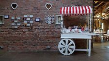 Sweet cart with glass bowls, scopes, bags wedding/event decor