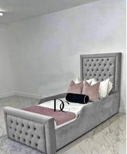 Kids single grey upholstered bed with safety side rails