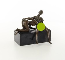 AN EROTIC BRONZE SCULPTURE OF