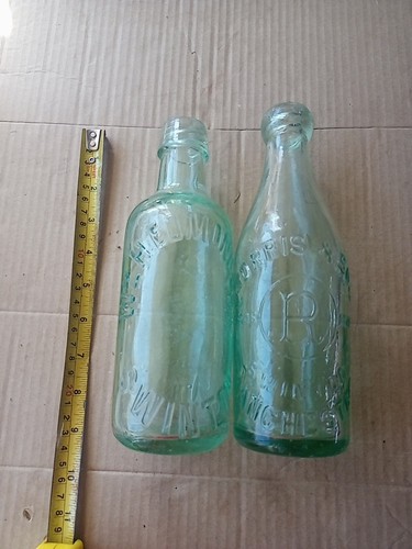 Two different swinton bottles - different,
