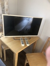 J V C 32 Inch 2 remotes