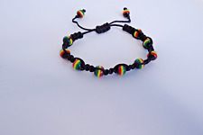 RASTA /JAMAICAN ADJUSTABLE BRAIDED BEADED UNISEX SURF/REGGAE BEACH WEAR BRACELET