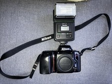 Nikon F50 35mm SLR film camera.and Starblitz Flash
