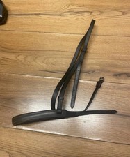 Full brown English leather padded 1” Hunter Cavesson noseband showing