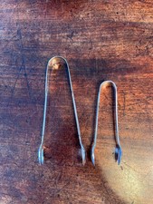Two Pairs Of Sugar Tongs One
