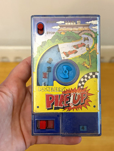Tomy handheld electronic game - handheld,