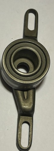 Camshaft timing belt tensioner