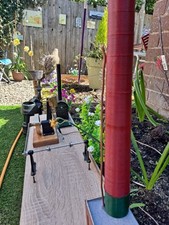 Steam engine with single cylinder vertical engine, boiler and lineshaft.