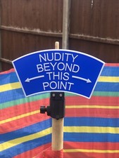 NUDITY BEYOND SIGN , WIND