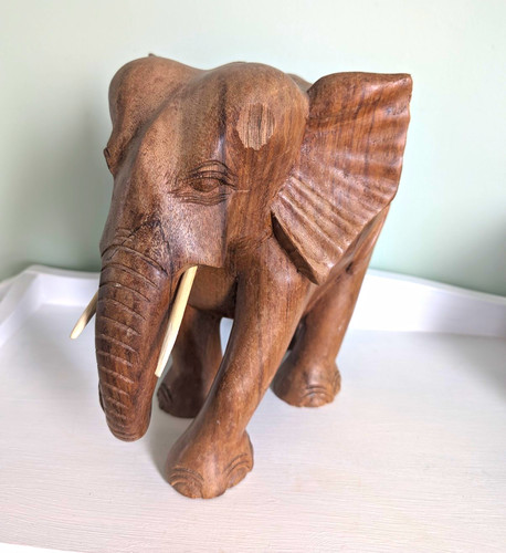 Hand carved wood - hand, elephant