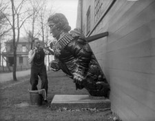 A Docker Cleans A Figurehead