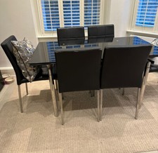 Black glass extending dining