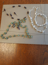 Three Necklaces, Two with Earings and one with Bracelet