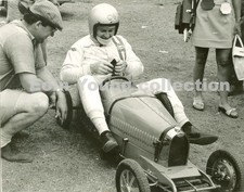 Bruce McLaren and Colin Crabbe with Bugatti pedal car. - Original photograph